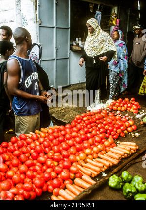 Muslim women shopping at the Darajani Market, the main market in Stone Town, Zanzibar, East Africa Stock Photo