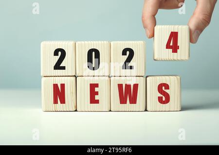 2024 news work written on wooden cubes. Stock Photo