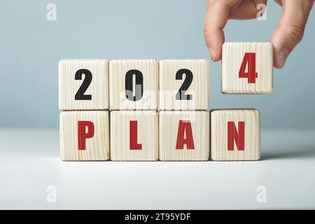 2024 plan work written on wooden cubes. Stock Photo