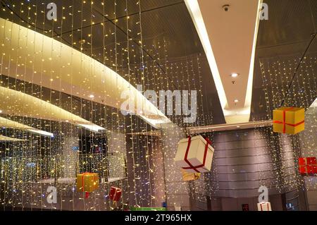 Christmas lights decoration and gift boxes on ceiling Stock Photo