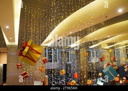 Dent cardboard gift box hanging on ceiling Stock Photo
