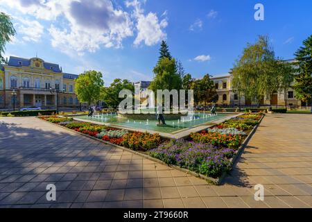 Ruse, Bulgaria - September 17, 2023: View of the old city center square and the Historical Museum, with locals, and visitors, in Ruse, northeastern Bu Stock Photo