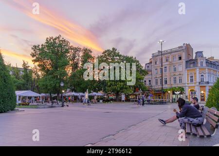 Ruse, Bulgaria - September 17, 2023: Sunset view of the central square, with locals, and visitors, Ruse, northeastern Bulgaria Stock Photo