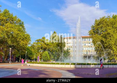 Varna, Bulgaria - September 22, 2023: View of the Independence square and fountain, with locals and visitors, Varna, Bulgaria Stock Photo