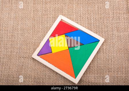 Colorful pieces of a square tangram puzzle Stock Photo