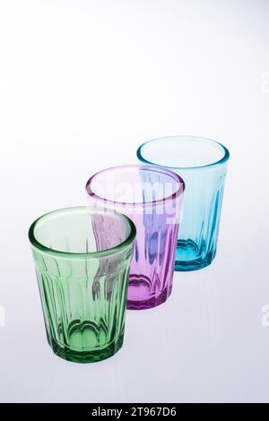 Colorful drinking glasses on white background Stock Photo