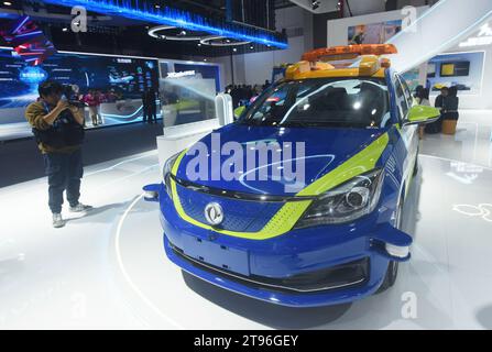 HANGZHOU, CHINA - NOVEMBER 23, 2023 - A photographer takes a photo of an intelligent patrol vehicle at the Hong Kong Airport during the 2nd Global Dig Stock Photo
