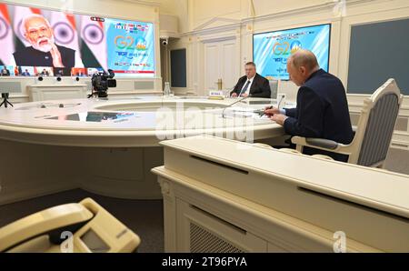 Moscow, Russia. 22nd Nov, 2023. Russian President Vladimir Putin, right, and Deputy Prime Minister Alexei Overchuk, left, take part in a an extraordinary G20 summit hosted by Indian Prime Minister Narendra Modi via video link from the Kremlin, November 22, 2023 in Moscow, Russia. Credit: Mikhail Klimentyev/Kremlin Pool/Alamy Live News Stock Photo