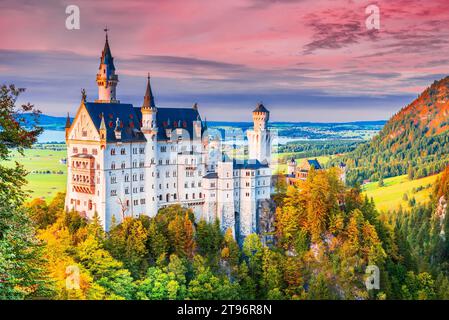Neuschwanstein, Germany. Charming castle in beautiful autumn colors in Bavarian Alps, Bayern travel landscape. Stock Photo