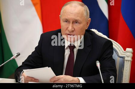 Moscow, Russia. 21st Nov, 2023. Russian President Vladimir Putin, right, takes part in a an extraordinary BRICS summit on the Palestinian-Israeli conflict via video link from the Kremlin, November 21, 2023 in Moscow, Russia. Credit: Mikhail Klimentyev/Kremlin Pool/Alamy Live News Stock Photo