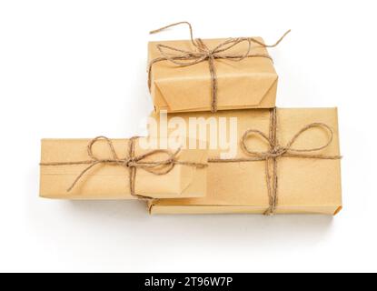 Brown crafted gift boxes and presents. Rustic aesthetic holiday celebration concept. Christmas holiday postcard Stock Photo