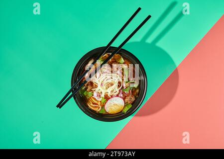 Birria ramen, consomme soup with beef and noodle. Mix of Mexican and Asian cuisine. Stock Photo