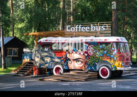 A cozy coffee bus that sells fresh coffee and cakes in the mountains Stock Photo
