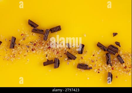 Surface of yellow fruit cake with chocolate pieces as background Stock Photo