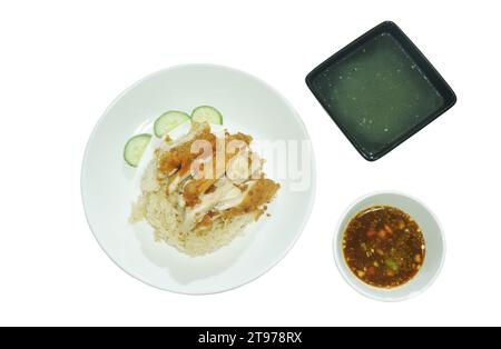 steamed rice topping chop crispy fried  chicken on plate with chili sauce and soup Stock Photo