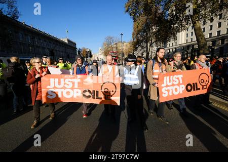 London, UK. 23rd Nov 2023. Just Stop Oil protesters march from Trafalgar Square to opposite Downing Street where they start to protest and are arrested.  Credit: Matthew Chattle/Alamy Live News Stock Photo