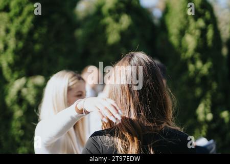 Students Collaborating Outdoors on University Project Stock Photo