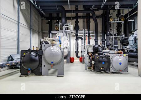 Machines and pipework in a factory for energy distribution Stock Photo