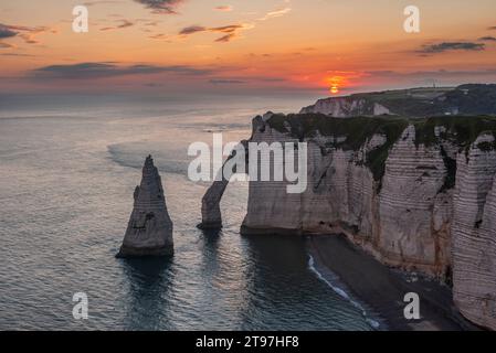 France, Normandy, Falaise dAval and Aiguille dEtretat rock formation at sunrise Stock Photo