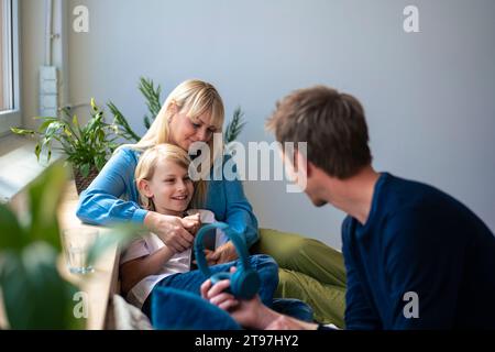 Happy family spending leisure time together at home Stock Photo