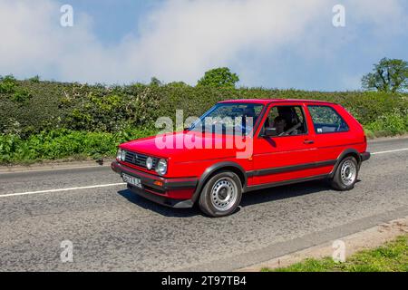 1989 80s eighties Red Volkswagen Golf Gti Red Car Hatchback Petrol 1781 cc; Vintage, restored British classic motors, automobile collectors,  motoring enthusiasts and historic veteran cars travelling in Cheshire, UK Stock Photo