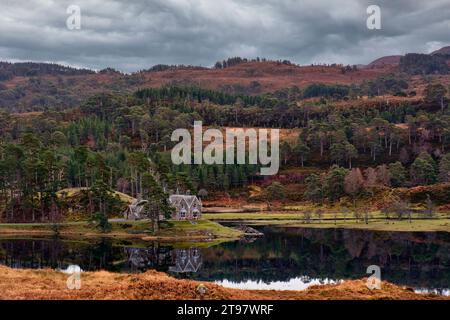 Glen Affric Cannich Scotland the Glen Affric Lodge and Loch Pollan Fearna with Scots Pine trees in autumn Stock Photo