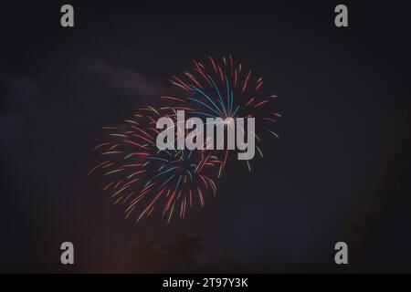 Fireworks On The Background Of The Dark Night Sky in Dalmine (BG),Italy, show for New Year's eve Stock Photo