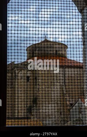 Church of St. Donatus seen through the metal grating on a window. Zadar, Croatia. Stock Photo