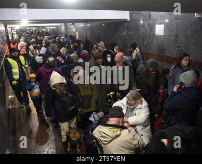 Lviv, Ukraine - March 8, 2022: Refugees near railway station of Lviv waiting for the train to Poland. Stock Photo
