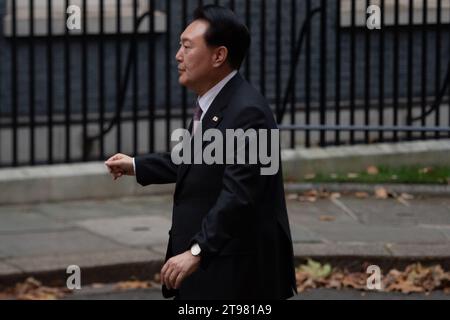 London, UK. 22nd November, 2023. Yoon Suk Yeol, The President of The Republic of Korea, made a visit to No 10 Downing Street this afternoon to meet Prime Minister, Rishi Sunak and his wife, Akshata Murty. Upon arrival he walked toward No 11 Downing Street by mistake and came back to No 10 where the red carpet was laid out for him. He is in the UK following a State Visit yesterday when he met the King and Queen at Buckingham Palace. The President was meeting Rishi Sunak about issues including defence, trade and technology. Credit: Maureen McLean/Alamy Live News Stock Photo