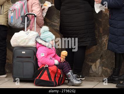 Lviv, Ukraine - March 2, 2022. Evacuees from eastern Ukraine near the railway station in western Ukrainian city of Lviv. Stock Photo