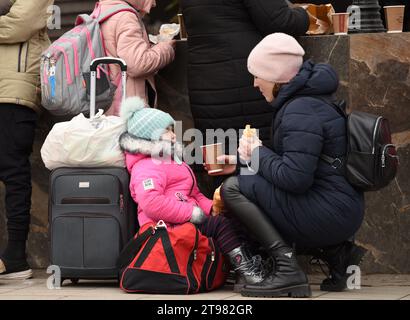 Lviv, Ukraine - March 2, 2022. Evacuees from eastern Ukraine near the railway station in western Ukrainian city of Lviv. Stock Photo