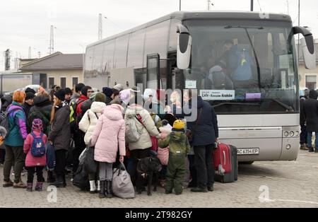 Lviv, Ukraine - March 2, 2022. Evacuees from eastern Ukraine in bus station of Lviv waiting for the bus to Poland. Stock Photo