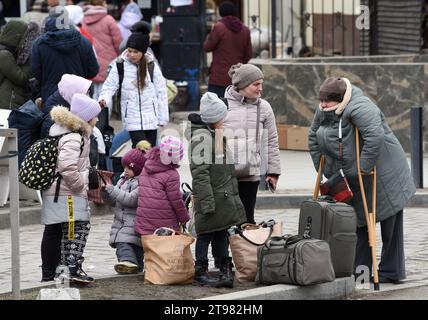 Lviv, Ukraine - March 6, 2022: Evacuees from eastern Ukraine near the railway station in western Ukrainian city of Lviv. Stock Photo