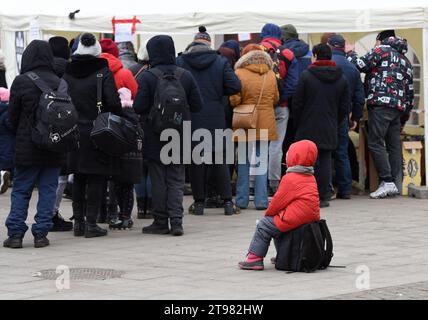 Lviv, Ukraine - March 6, 2022: Evacuees from eastern Ukraine near the railway station in western Ukrainian city of Lviv. Stock Photo
