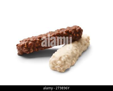 Chocolate bars in white and milk chocolate with crispy wafers and caramel isolated on white background. Multicolored chocolate bars. Stock Photo