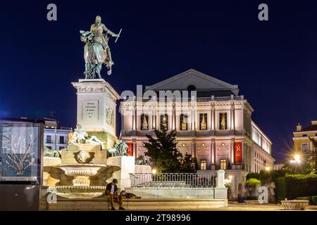 Madrid, Spain, 09.10.21. The Monument to Felipe IV by Pietro Tacca and The Teatro Real (Royal Theatre) on Plaza de Oriente, illuminated at night. Stock Photo