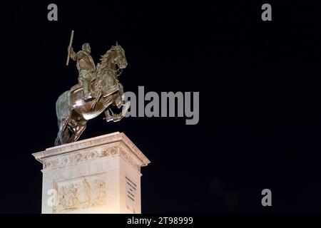 Madrid, Spain, 09.10.21. The Monument to Felipe IV by Pietro Tacca on Plaza de Oriente, equestrian sculpture on a pedestal with bas-reliefs, at night. Stock Photo