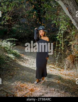 Beauxbatons Witch Enchanting Young Asian Woman Wearing Grey Long Sleeve Dress, Wig, Hat, Fit Curvy Figure Stock Photo