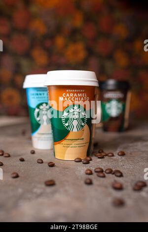 starbucks coffee in cups in assortment on the table. Stock Photo