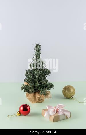 Creative Christmas layout with Christmas tree on mint green background. Retro New Year party background. Stock Photo