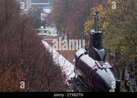 Gdynia, Poland. 23 November 2023. Decommissioned Polish Kobben-class submarine ORP Sokol 294, former Norwegian HNoMS Stord (S-308), is transported to the Naval Museum to be an open-air exposition © Wojciech Strozyk / Alamy Live News Stock Photo