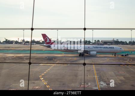 Turkish Airlines plane on the take-off pad, view from the terminal of Phuket airport, Thailand, 03.23.2022 Stock Photo