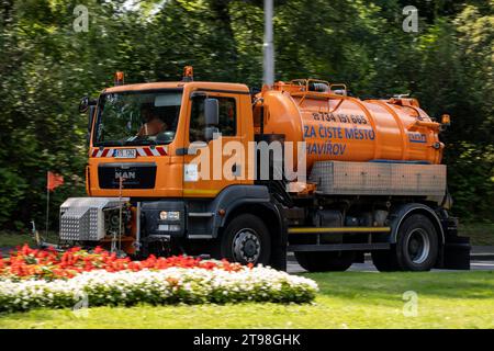 HAVIROV, CZECH REPUBLIC - AUGUST 10, 2023: Orange TGM 18.340 cleaning truck on a street with motion blur effect in Havirov streets Stock Photo