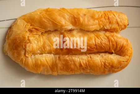 Burek with cheese - national dish, popular in the Balkans. Burek traditional Albanian food made with cheese. Balkan Bakery Breakfast Serving of Byrek Stock Photo