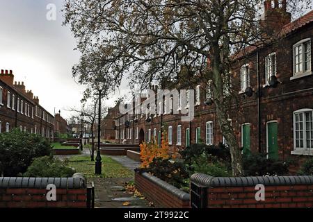 Autumn in the New Frodingham village in Scunthorpe, Former iron workers green doored homes in Lindsay Street, autumn colour in the leaves of the trees Stock Photo