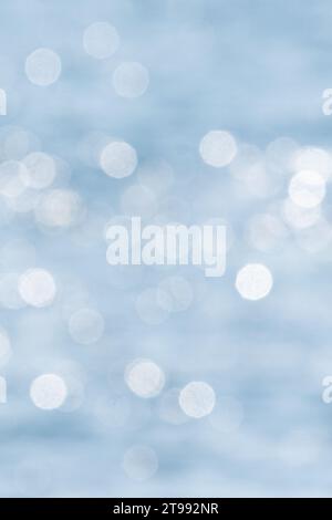 Sparkling pale blue sea bokeh background Stock Photo