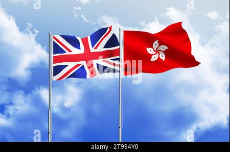 Hong Kong,UK flags together waving against blue sky Stock Photo