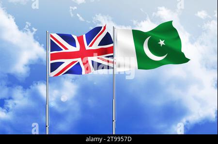 Pakistan,UK flags together waving against blue sky Stock Photo