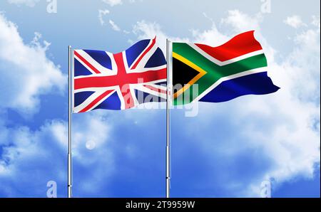 South Africa,UK flags together waving against blue sky Stock Photo